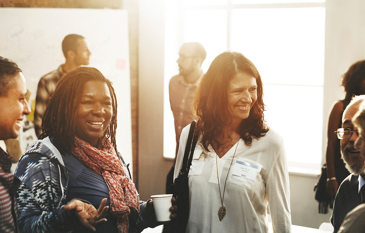 Group of people chatting informally at an event