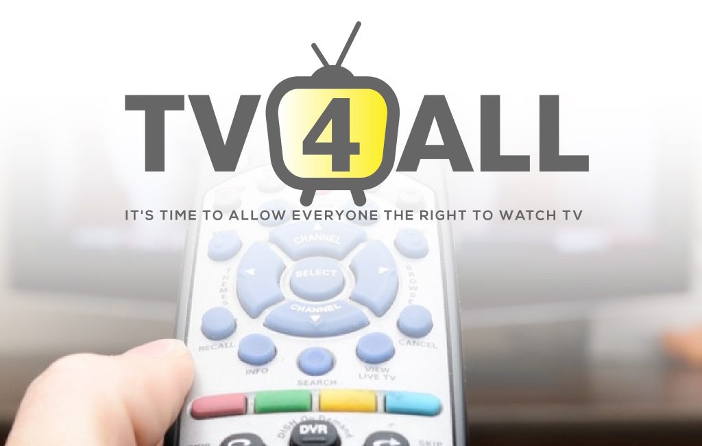 A hand holding a TV remote with the words "TV4ALL - it's time to allow everyone the right to watch TV"